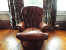 An oxblood leather arm chair,