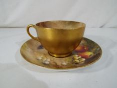 Royal Worcester - a large cup and saucer set by Royal Worcester in the Fallen Fruits pattern,