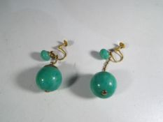 A pair of lady's 9 carat gold and green stone/marble/glass earrings