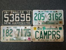 Four American US vintage automobile number plates,