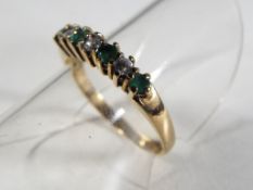 A lady's hallmarked 9 carat yellow gold ring set with emerald and cz, size K, approximate weight 1.