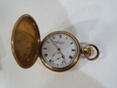 A yellow metal full hunter, the white dial scribed Everite, H Samuel, Manchester,