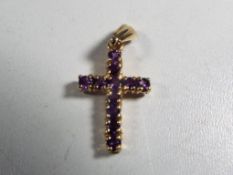 A hallmarked 9 carat gold and amethyst cross