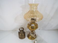 A brass oil lamp with glass shade and other (2)