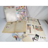 Philately - four albums containing a quantity of UK and worldwide postage stamps.