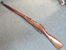A deactivated U.S.S.R Mosin Nagant rifle chambered in 7.62. Serial number MM8447.
