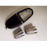 Charles Horner - two graduated sterling silver thimbles over a steel core, marked 'CH 6 Dorcas',