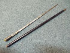 An 19th century carved African sword cane with locking ring an lion head top - NOTE: Please read