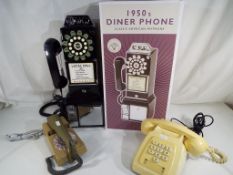 A 1950s style diner phone classic American payphone with push button dial,