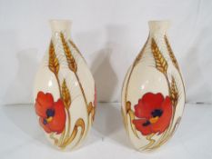Moorcroft Pottery - A large pair of Moorcroft Pottery vases in the Harvest Poppy pattern by Emma