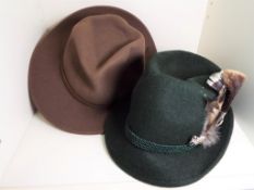 A Tirol hat, size 60 and an American broad rimmed hat,