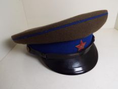 USSR - a Russian visor cap with blue banding and piping,