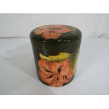 Moorcroft Pottery - A round lidded pot b