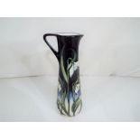 Moorcroft - a Moorcroft jug decorated in the Snow Fairy pattern, approximately 18.5 cm (h).