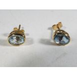 A pair of 9 carat gold and oval cut topa