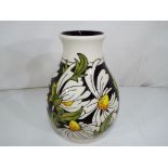 Moorcroft - a good quality Moorcroft vase decorated in the Pheobe pattern, 19 cm (h).