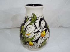 Moorcroft - a good quality Moorcroft vase decorated in the Pheobe pattern, 19 cm (h).