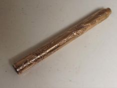 A lady's yellow metal propelling pencil