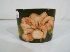 Moorcroft Pottery - a small oval pot by
