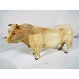 Beswick Pottery - A ceramic model of a Charolais bull by Beswick Pottery,