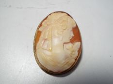 A hallmarked 9ct gold large cameo brooch