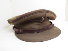 A British Army peak visor cap bearing SA