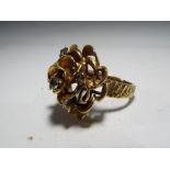 A lady's hallmarked 18 carat gold flower