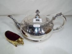 A good quality plated teapot and a heavy brass pin cushion in the form of a pig (2)