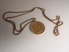 A gold Sovereign, Elizabeth 1978 in hallmarked 9 carat gold mount with yellow metal chain,