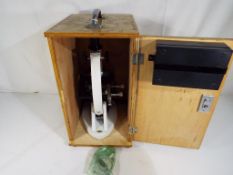 A Brunel Microscopes Ltd microscope in wooden case