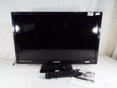 A Blaupunkt LED HD ready flat screen 23 inch television with built-in DVD player, with power lead,