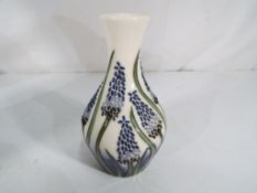 Moorcroft Pottery - a Moorcroft Pottery vase in the Muscari pattern, approx 13.