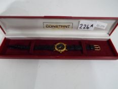 A lady's wristwatch marked Constant, boxed.