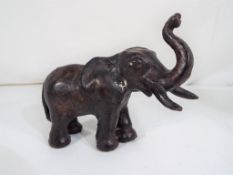 A small bronze model of an elephant, approx 11.