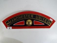 A replica cast brass Manchester United Football Club nameplate, based on British Rail train No.