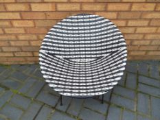 A good quality retro basket chair in black and white