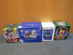Christmas decorations - four boxed Christmas decorations to include musical carousel, snow globe,