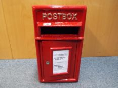 A cast iron red post box approx 44cm x 24.