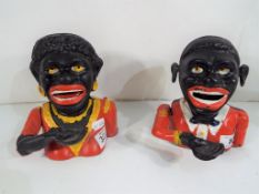 Two cast iron money banks in the form of a black man and a black woman (2)