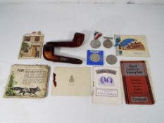A good lot to include a cased pipe with white metal mount (presumed silver),