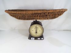 A vintage Boots The Chemists Baby weighing scale by Salter marked Baby Wire marked number 48B to