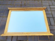 A bevel edged over mantel mirror with gilded frame,