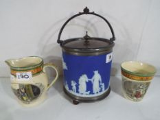 A dark blue Wedgwood Jasperware biscuit barrel and two pieces of ceramics by Adams comprising a