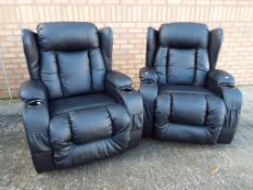 A matching pair of large black faux leather arm chairs,