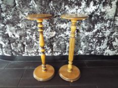 Two wooden plant stands.