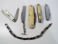 Five fruit knives / pen knives to include one hallmarked silver 1931,