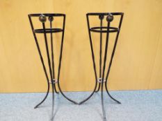 A matching pair of cast iron jardiniere holders.