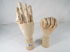 Two wooden moveable jointed hands Est £30 - £50