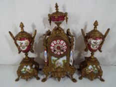 A French mantel clock garniture,