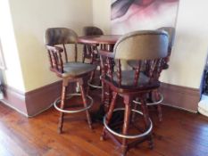 A good quality bar table with four matching swivel chairs with faux leather,